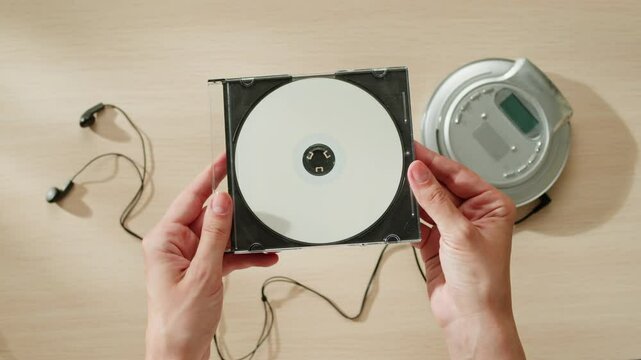 CD Player, Using headphone for old music portable compact player close-up. Listen to music with vintage player. 