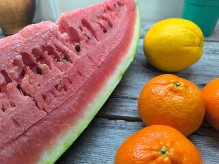 ripe juicy fruits on a wooden table.