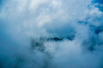 Mysterious cloud formation over mountainous terrain aerial view nature photography serene atmosphere atmospheric effects