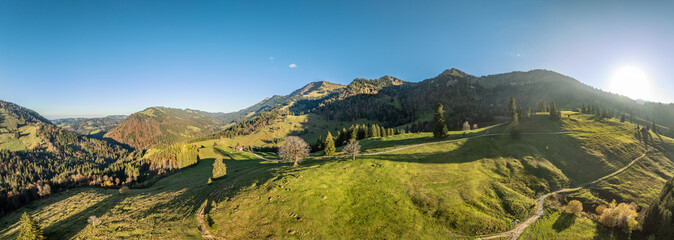 panoramic aerial view in Autumn of the alpine landscape of the Nagelfluh mountain chain in Steibis,...