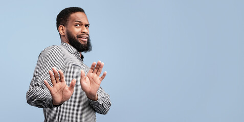 Ew, It's So Gross. Young african man with disgusted expression repulsing something, saying please...