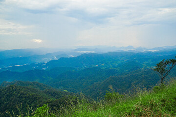 Breathtaking mountain view overlooking lush valley nature landscape serene environment aerial perspective peaceful atmosphere