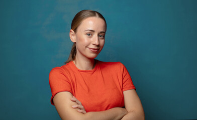 smiling to camera with crossed arms and a happy, confident, satisfied expression, lateral view