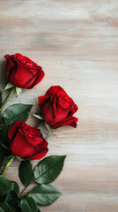 Three red roses with green leaves on wooden background, symbolizing love and beauty. Perfect for romantic occasions.  valentine
