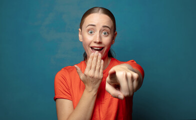 laughing at you, pointing to camera and making fun of or mocking you
