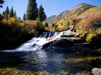 waterfall in autumn forest