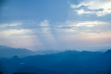 Fototapeta premium Dramatic sunset sky over mountain range nature landscape evening view serene environment atmospheric beauty