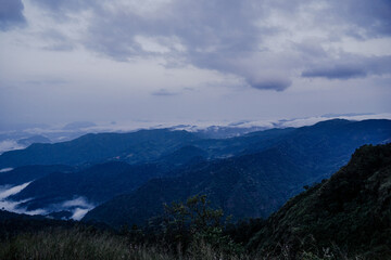 Naklejka premium Breathtaking mountain vista nature's beauty landscape photography cloudy skies panoramic view serenity in nature