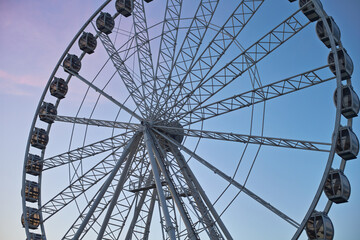 Fototapeta premium Close up of ferris wheel with colourfull sky.