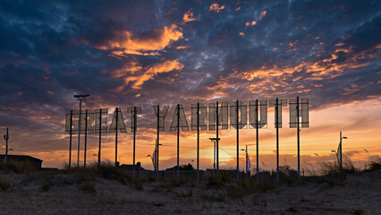 Colourful dramatic sunset landscape with Great Yarmouth sign.