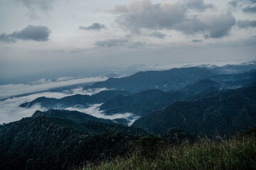Fototapeta premium Breathtaking mountain range sunrise cloudy atmosphere landscape photography nature panoramic view serenity and adventure