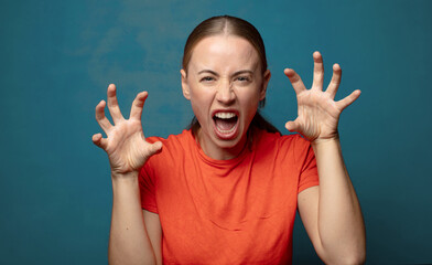 screaming in panic or anger, shocked, terrified or furious, with hands next to head