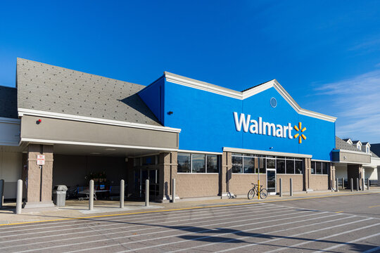 Walmart store exterior. Walmart is an American multinational corporation that runs large discount stores and is the world's largest public corporation.