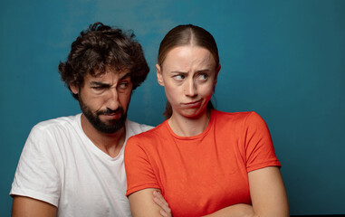 feeling displeased and disappointed, looking serious, annoyed and angry with crossed arms