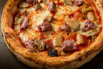 italian pizza gourmet with cep mushroom and sausage