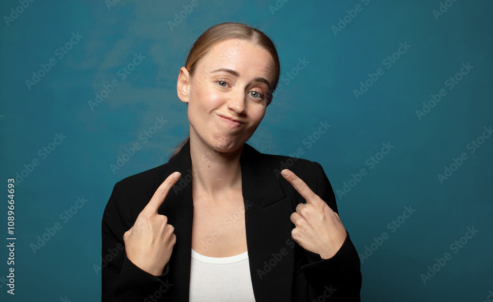 Wall mural with a bad attitude looking proud and aggressive, pointing upwards or making fun sign with hands