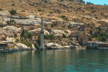 View of the only remaining minaret from the abandoned old city of Halfeti, destroyed by rising...