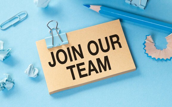 Blue and Brown Join Our Team Sign with Blue Pencil and Paperclips on Blue Background