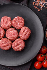 Raw meatballs of minced meat beef, pork or chicken with salt, spices
