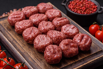 Raw meatballs of minced meat beef, pork or chicken with salt, spices