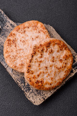 Grilled chicken burger cutlet with salt, spices and herbs
