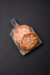 Grilled chicken burger cutlet with salt, spices and herbs