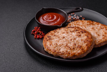 Grilled chicken burger cutlet with salt, spices and herbs