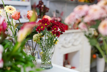 The hands of florist, making bouquets and flower arrangements. Woman collecting a bouquet of flowers. floristry