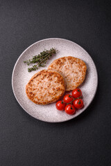 Grilled chicken burger cutlet with salt, spices and herbs