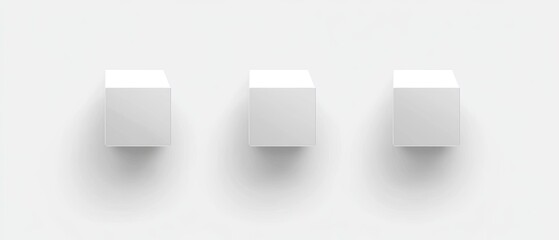 Three white cubes on a white background.