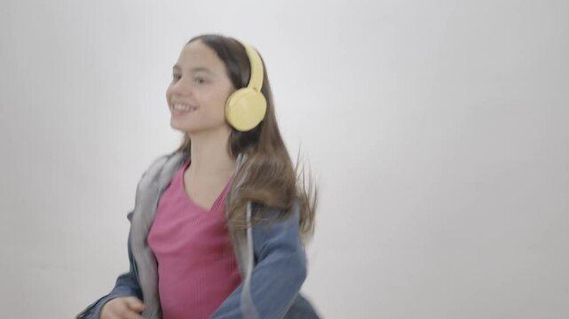 teengirl happy with headphone on studio