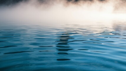 Obraz premium Serene Geothermal Pool: Misty morning over a tranquil geothermal pool. The water's surface shimmers, reflecting the soft light. A sense of calm and mystery pervades the scene.