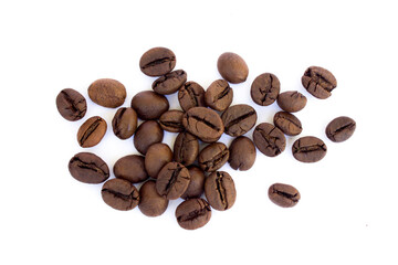 Naklejka premium Roasted Robusta coffee beans scattered on a white background.