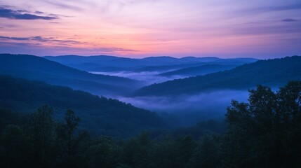 Obraz premium Serene Mountain Mist At Sunrise Over Rolling Hills