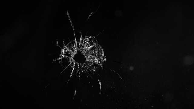 Super Slow Motion of Shattered Glass Isolated on Black Background. Break Glass from the Gunshot. Filmed on High Speed Cinema Camera, 1000 fps.