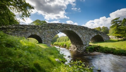 Fototapeta premium A view of a Stone Bridge over a fast flowing river
