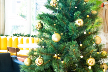 Christmas Tree with Decorations in cozy home interior,Festive image in holiday,Merry Christmas and Happy New Year..