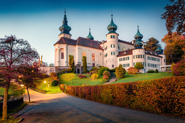 Fantastic autumn dawn in Austrian countryside with Castle parish church of St. Jacob D. A....