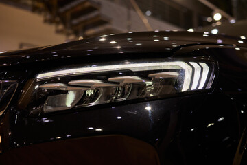 Close up of a cars headlight, part of automotive design