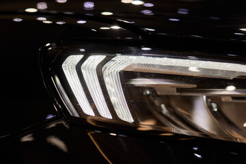 Close up of a cars headlight, part of automotive design