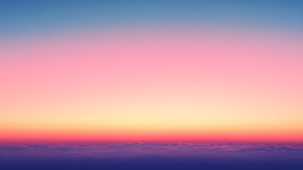 Fototapeta premium A serene gradient sky transitions from deep blue at the top to soft pink and orange hues near the horizon, creating a tranquil atmosphere.