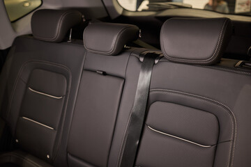 Obraz premium Car back seat with headrest and arm rest, a comfortable automotive fixture