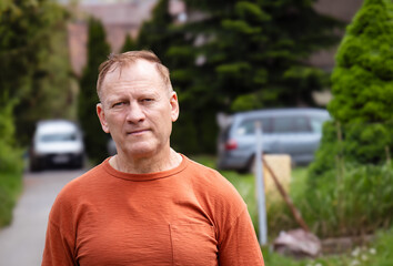 portrait of handsome european mature man in park