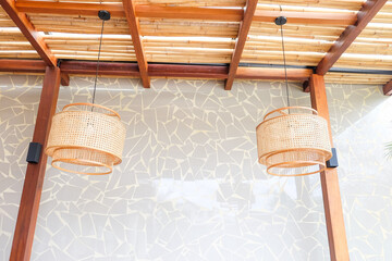 Wicker lampshade in outdoor restaurant,Pendant light with Rattan lamps in street cafe,decorating...