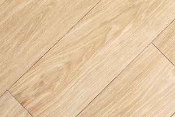 Wood-patterned ceramic tiles arranged in diagonal layout, mimicking natural wood floor