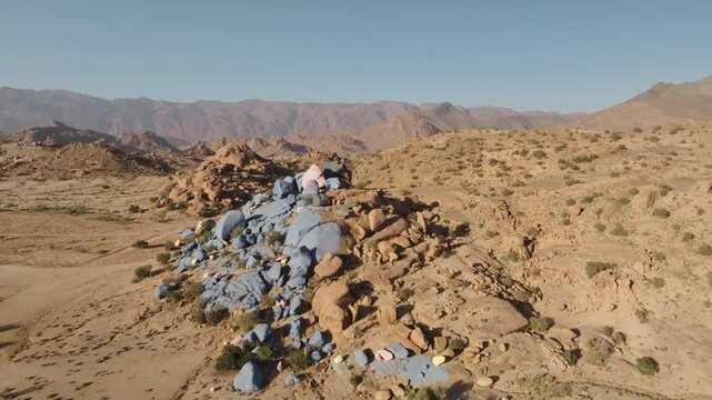 Famous blue pink painted rocks in Morocco aerial 