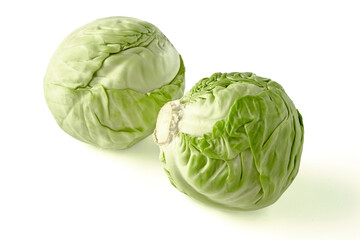 Obraz premium two heads of white cabbage isolated on white background