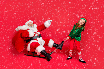 Full size photo of santa claus rider in eyewear eyeglasses spectacles and small redhair elf hat...
