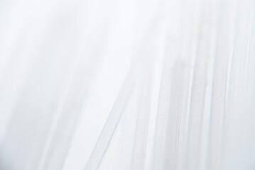 Close-up view of sheer white fabric draped softly, midday light