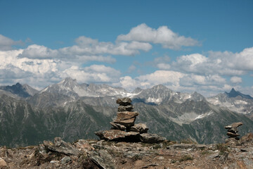 Pyramid made of stones on top of a mountain. Balance, equilibrium symbol. Beauty in nature. Alternative therapy.